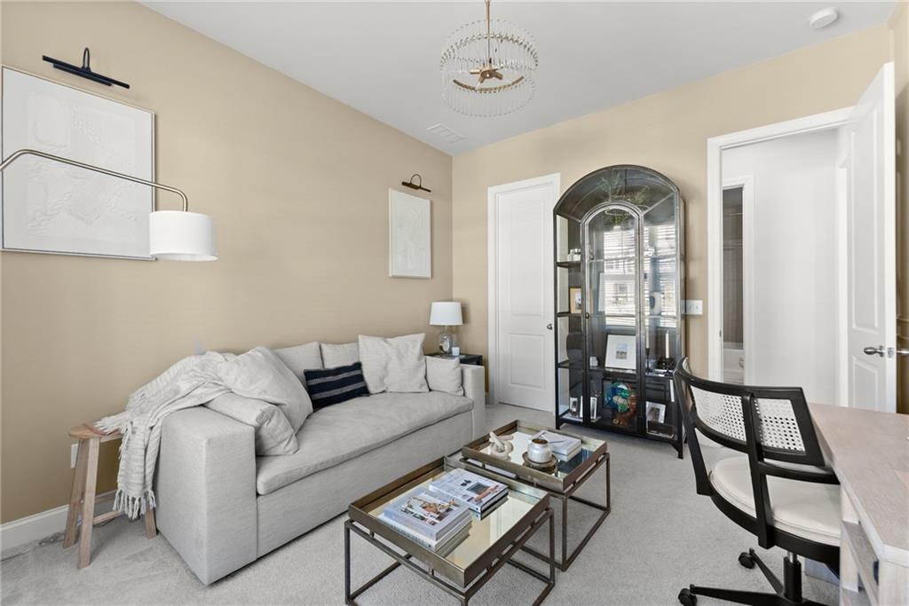 3675 Andover Street Cumming, GA 30028 - Photo 22 of 52 a living room with furniture a rug and a window
