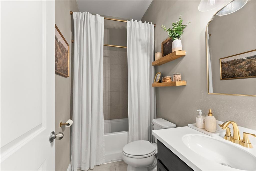 3675 Andover Street Cumming, GA 30028 - Photo 23 of 52 a bathroom with a sink toilet and shower