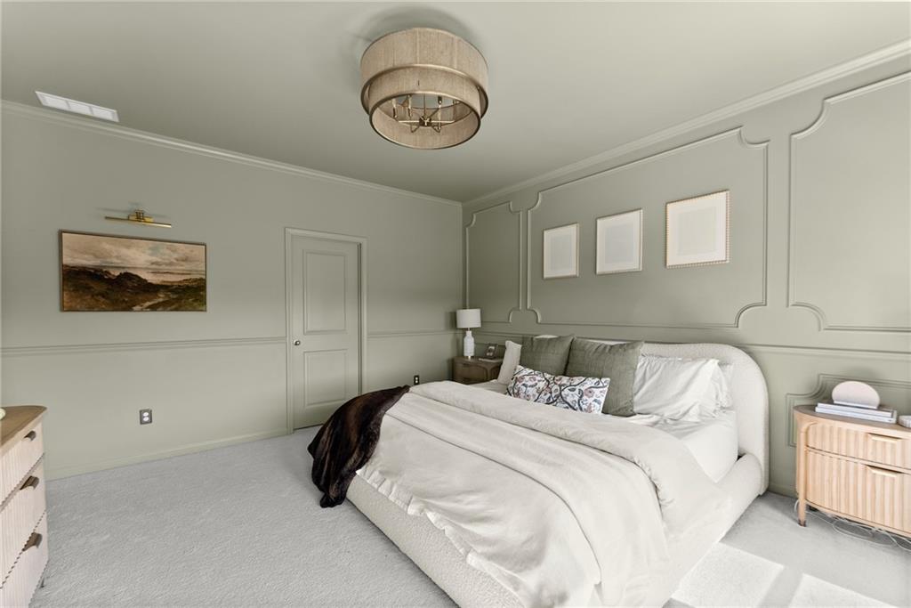 3675 Andover Street Cumming, GA 30028 - Photo 25 of 52 a bedroom with a bed and a chandelier