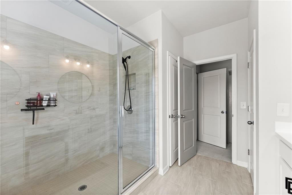 3675 Andover Street Cumming, GA 30028 - Photo 30 of 52 a bathroom with a shower