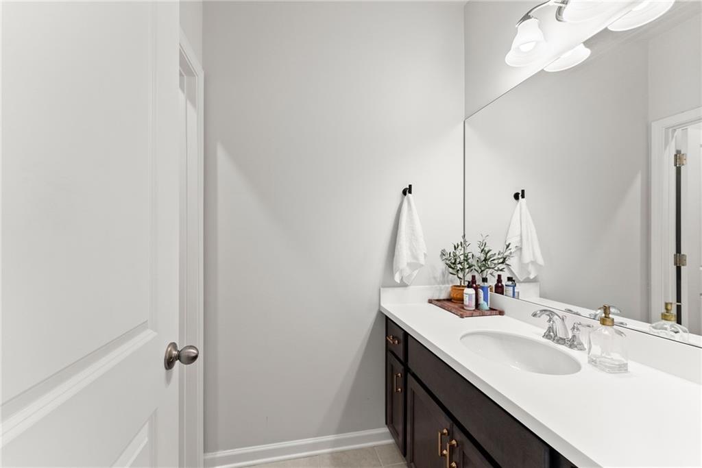 3675 Andover Street Cumming, GA 30028 - Photo 31 of 52 a bathroom with a sink and a mirror