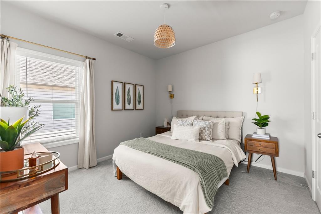 3675 Andover Street Cumming, GA 30028 - Photo 34 of 52 a bedroom with a bed and a potted plant