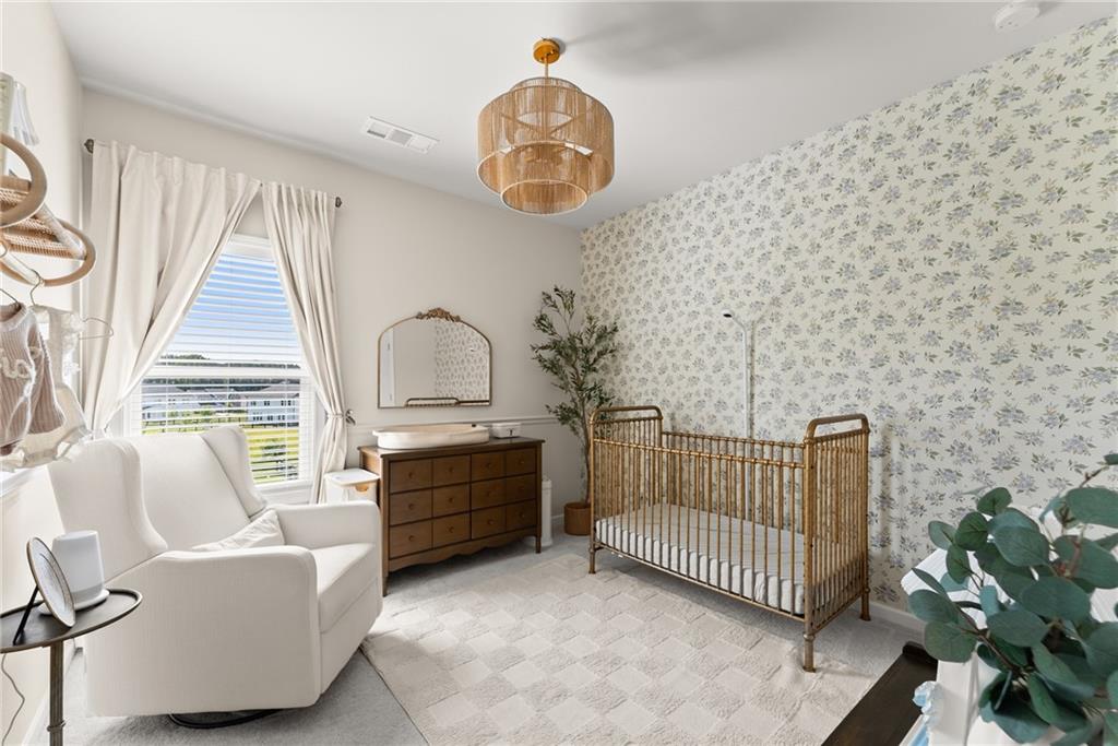 3675 Andover Street Cumming, GA 30028 - Photo 36 of 52 a bedroom with furniture and a window