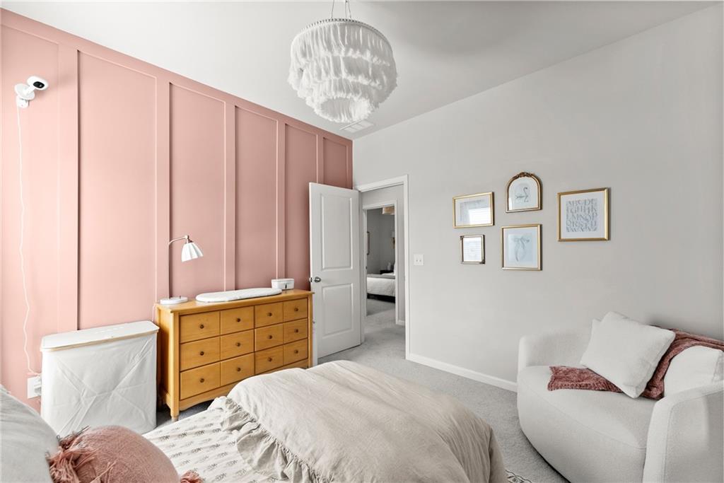 3675 Andover Street Cumming, GA 30028 - Photo 39 of 52 a bedroom with a bed and furniture