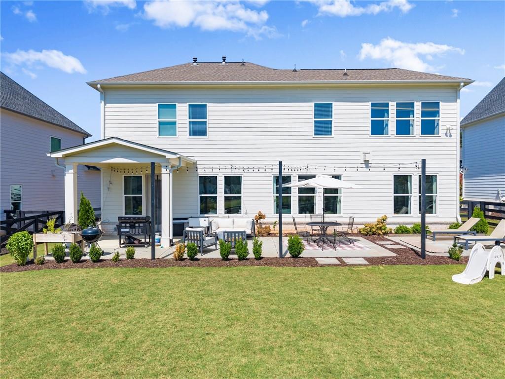 3675 Andover Street Cumming, GA 30028 - Photo 48 of 52 a front view of house with outdoor seating