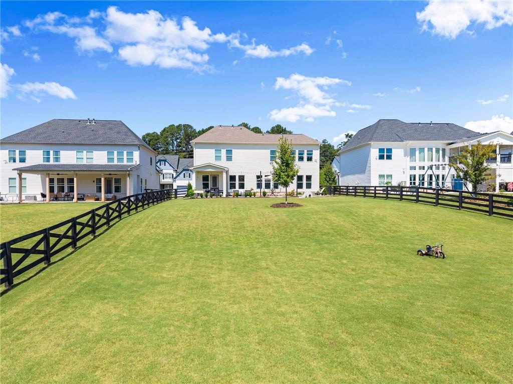 3675 Andover Street Cumming, GA 30028 - Photo 49 of 52 a view of a house with a big yard