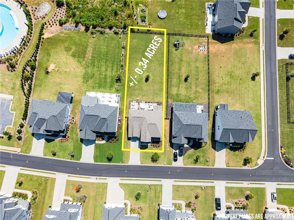 3675 Andover Street Cumming, GA 30028 - Photo 50 of 52 aerial view of residential house with outdoor space and seating
