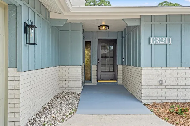 a view of a wooden door of the house