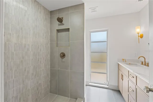 a bathroom with a double vanity sink a vanity and a mirror