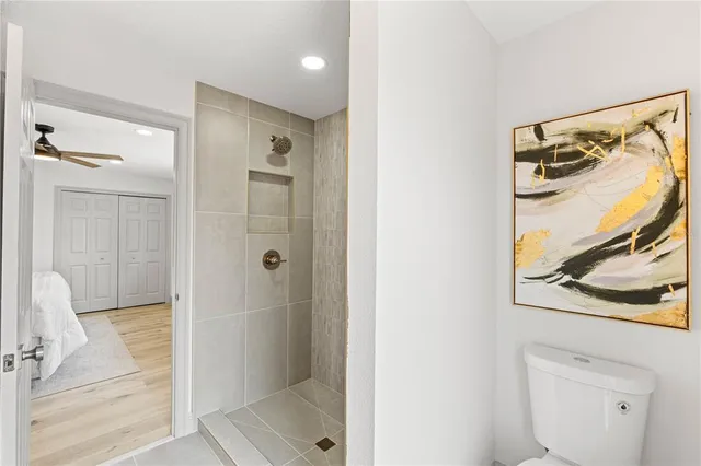 a bathroom with a shower and mirror