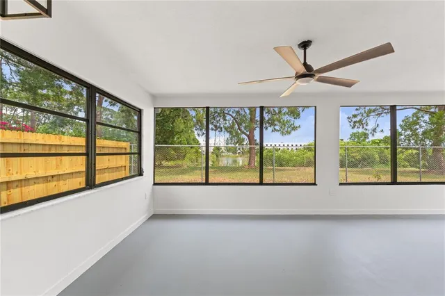 a view of room with window and ceiling fan