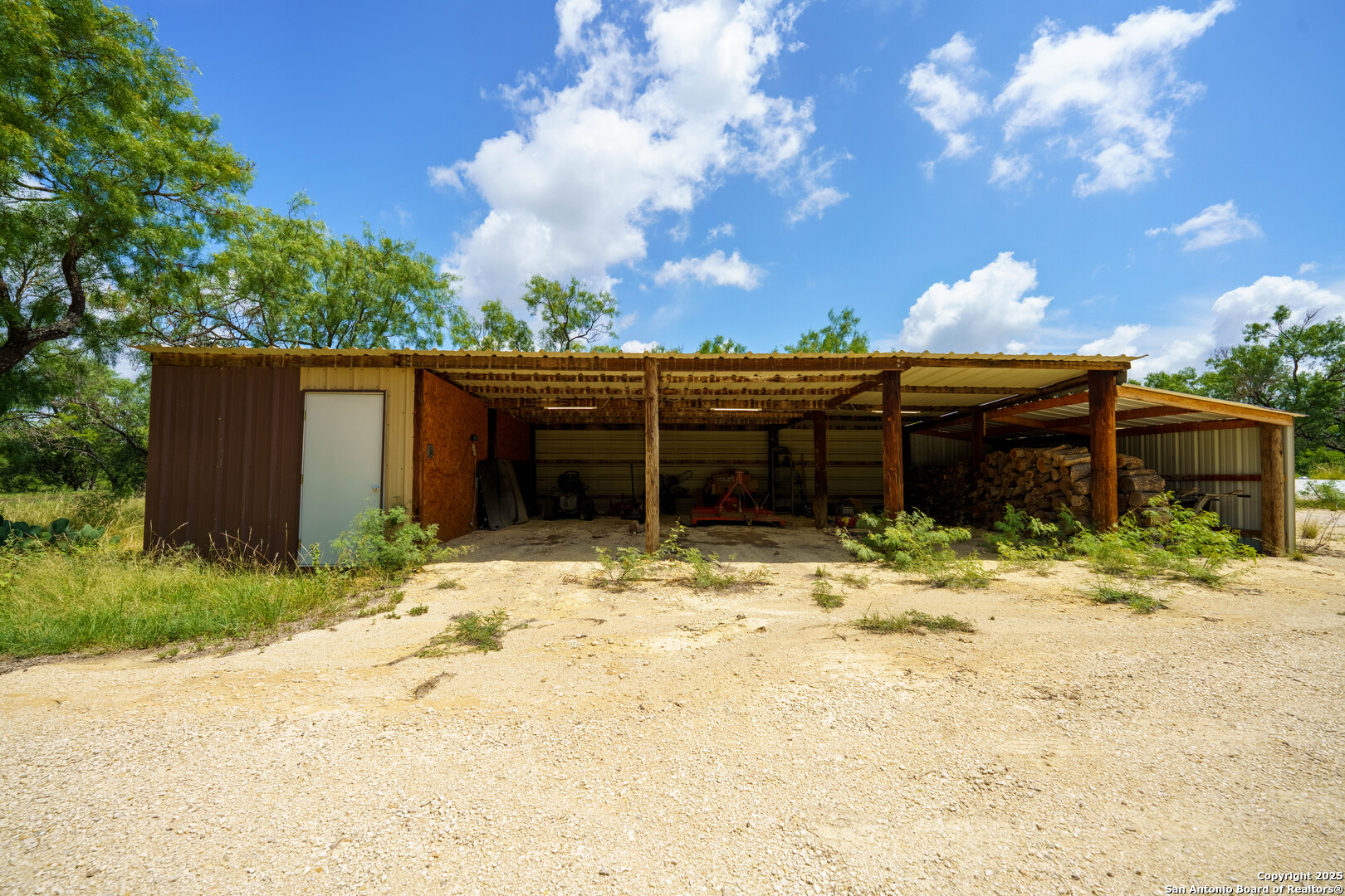 1231 B & R Road Vanderpool, TX 78885 - Photo 20 of 26 a view of a house with a yard covered in snow