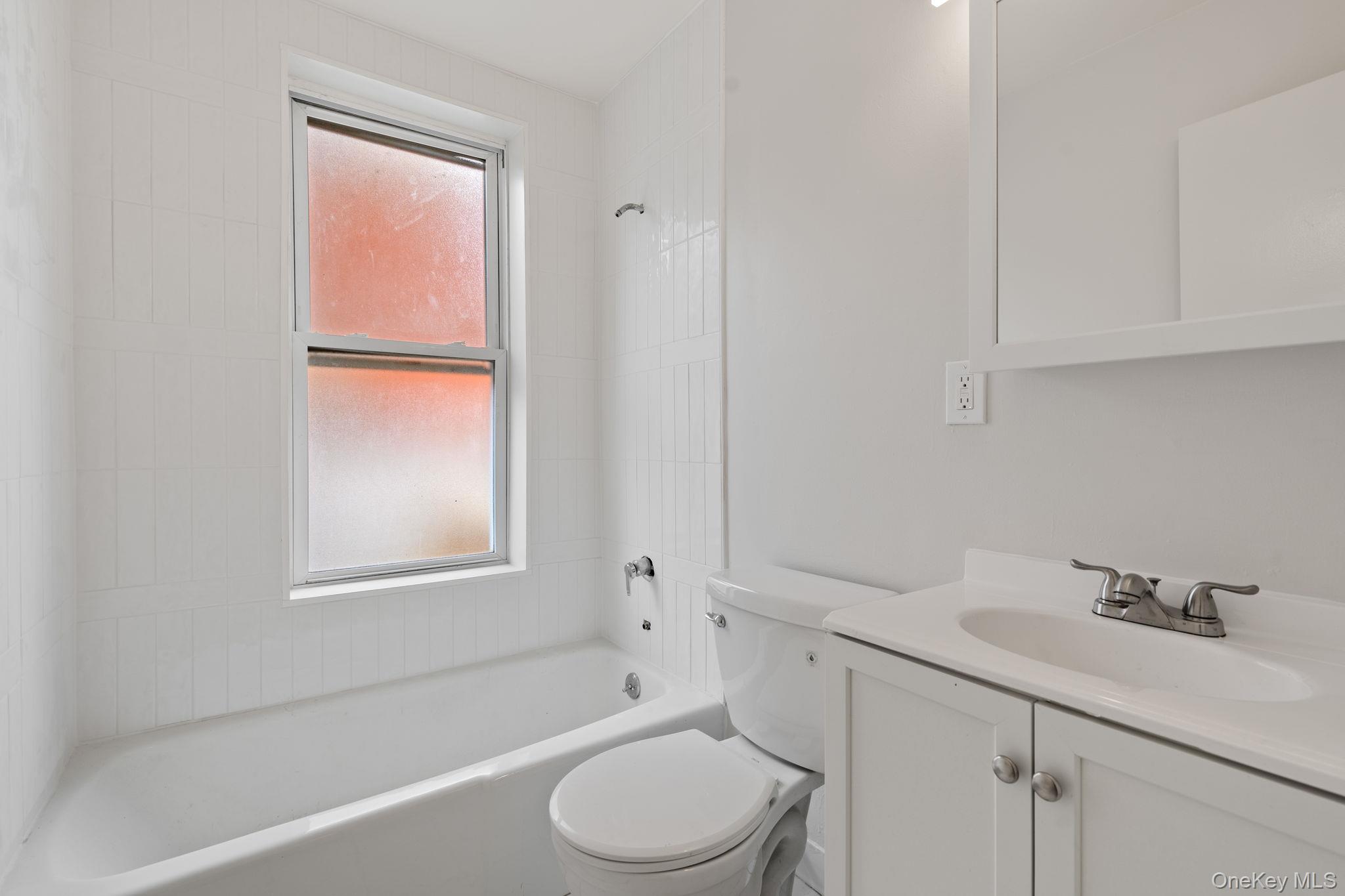 32 North Bridge Street Poughkeepsie, NY 12601 - Photo 13 of 19 a bathroom with a sink toilet and shower