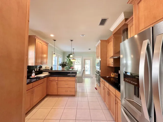 a living room with furniture and flowers