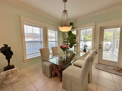 a living room with furniture and flowers