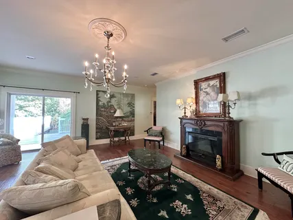 a view of a chairs and table in patio with a yard