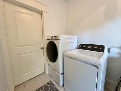a bathroom with a shower and a bath tub