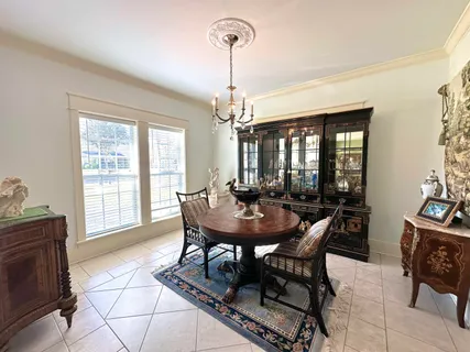 a living room with furniture a window and a table