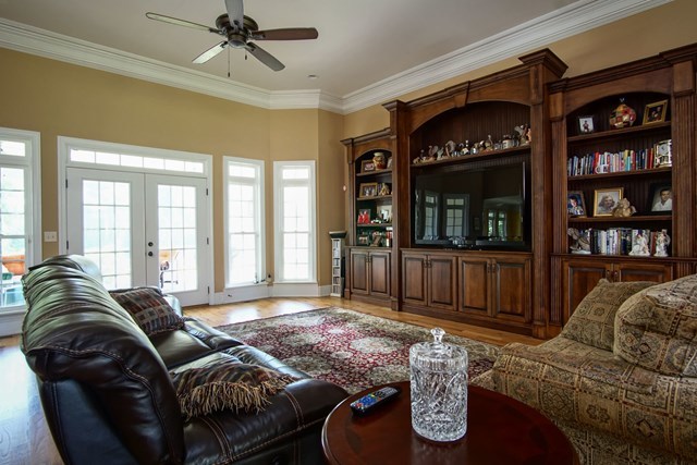 112 Pate Road Macon, GA 31210 - Photo 13 of 24 a living room with furniture a ceiling fan and a rug