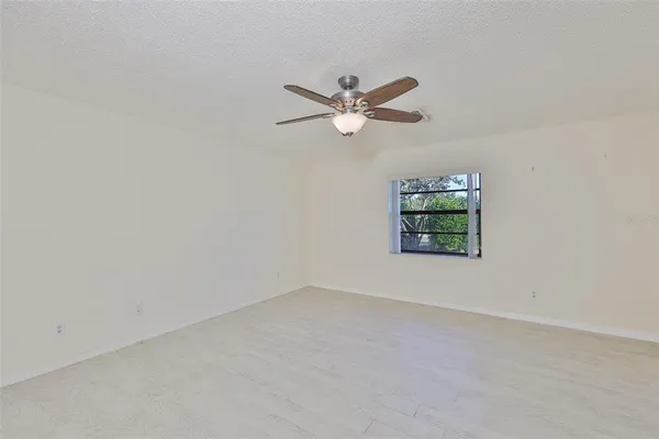 a bedroom with a large bed and a couch