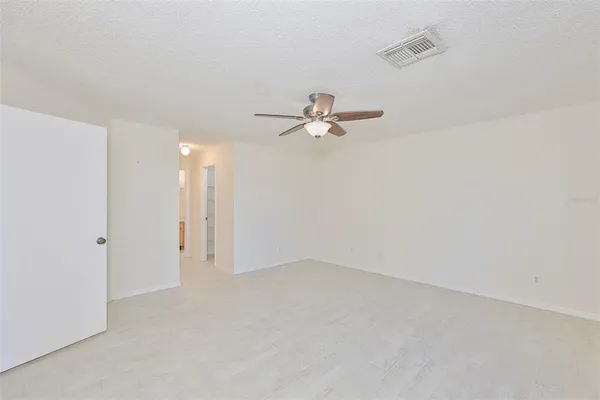 a bathroom with a sink toilet vanity and shower