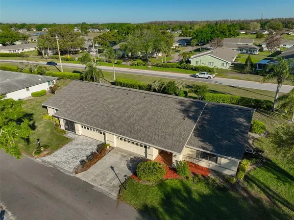 an aerial view of a house with a garden