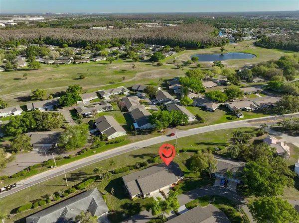 an aerial view of residential houses with outdoor space