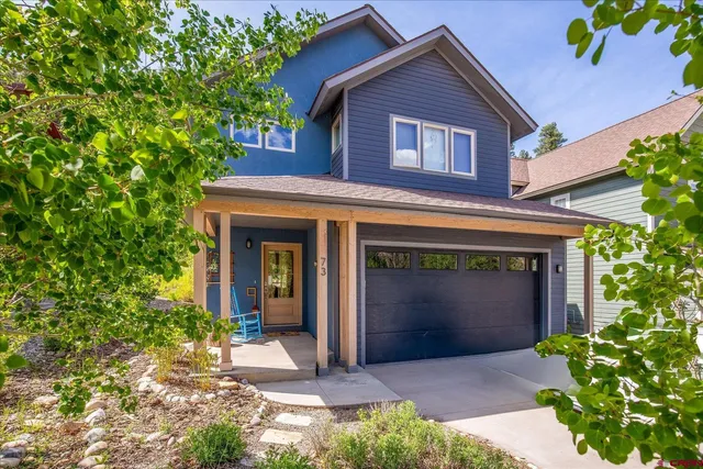 a front view of a house with yard
