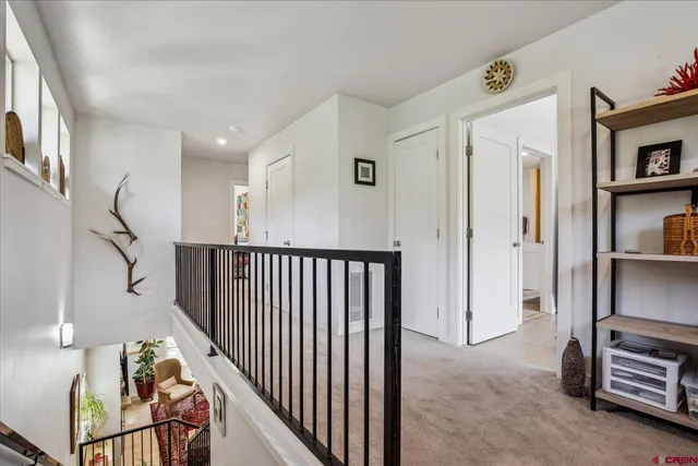 a view of a hallway with workspace and entryway