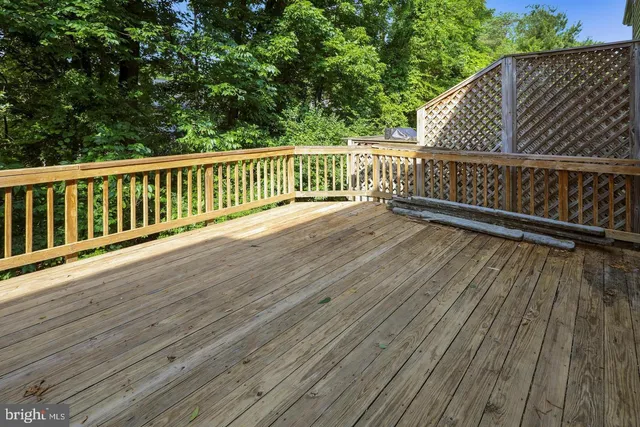 a view of deck with patio and wooden floor