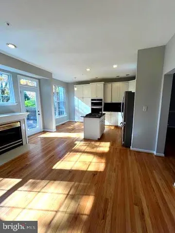a view of kitchen with wooden floor
