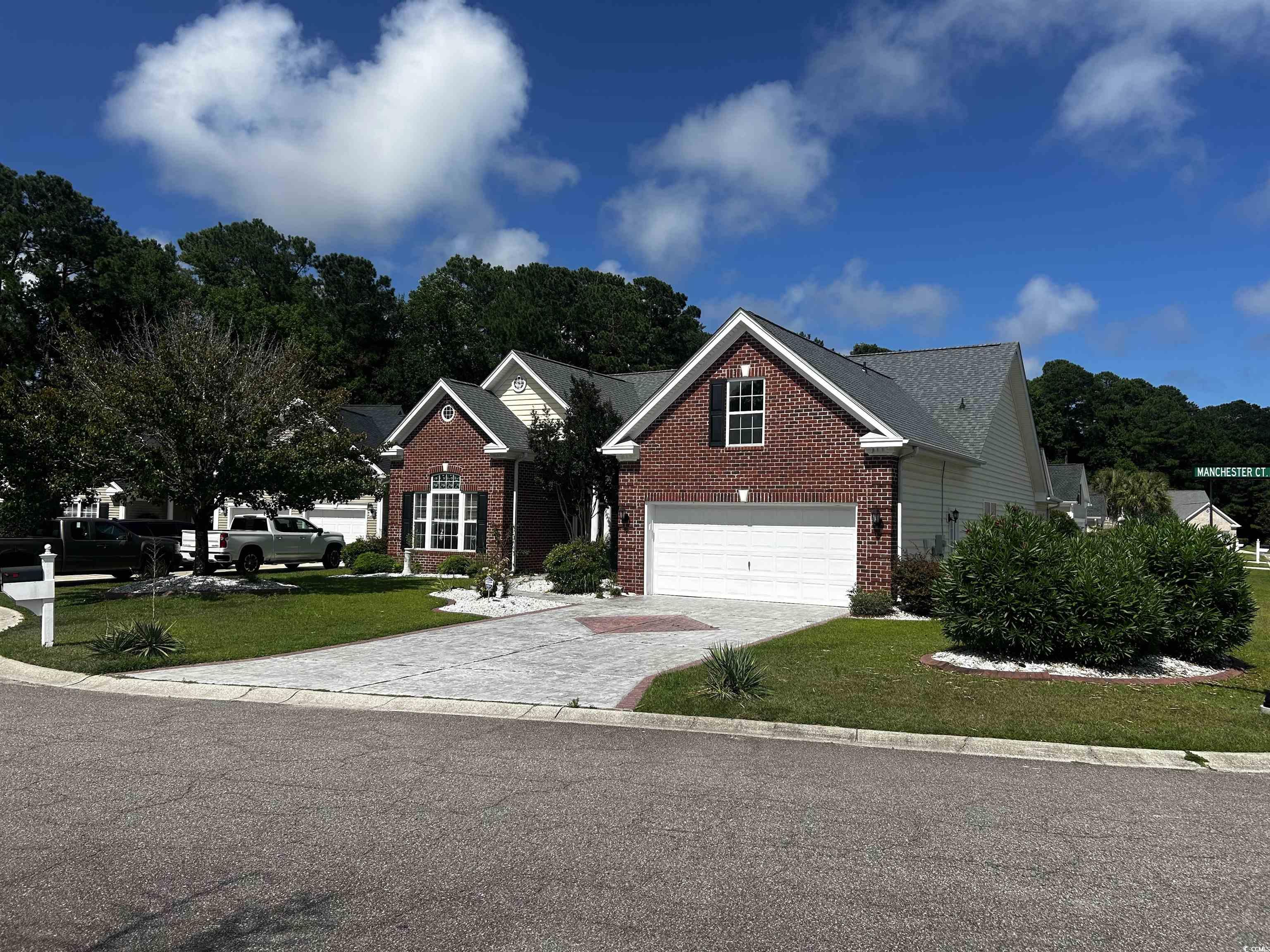1300 Manchester Court Murrells Inlet, SC 29576 - Photo 1 of 40 View of front facade featuring a garage and a fron