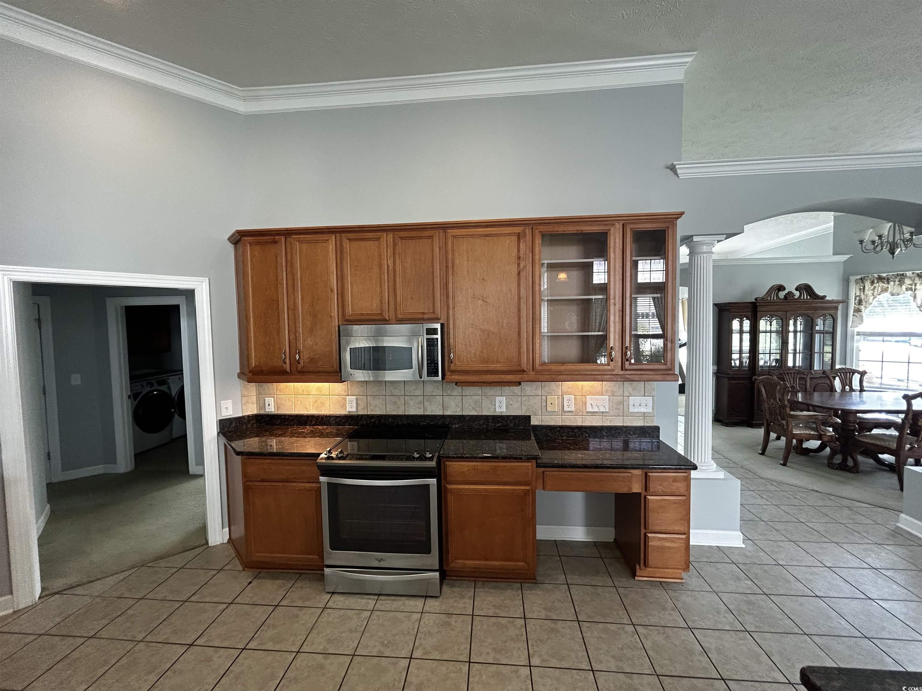 1300 Manchester Court Murrells Inlet, SC 29576 - Photo 11 of 40 Kitchen featuring backsplash, appliances with stai