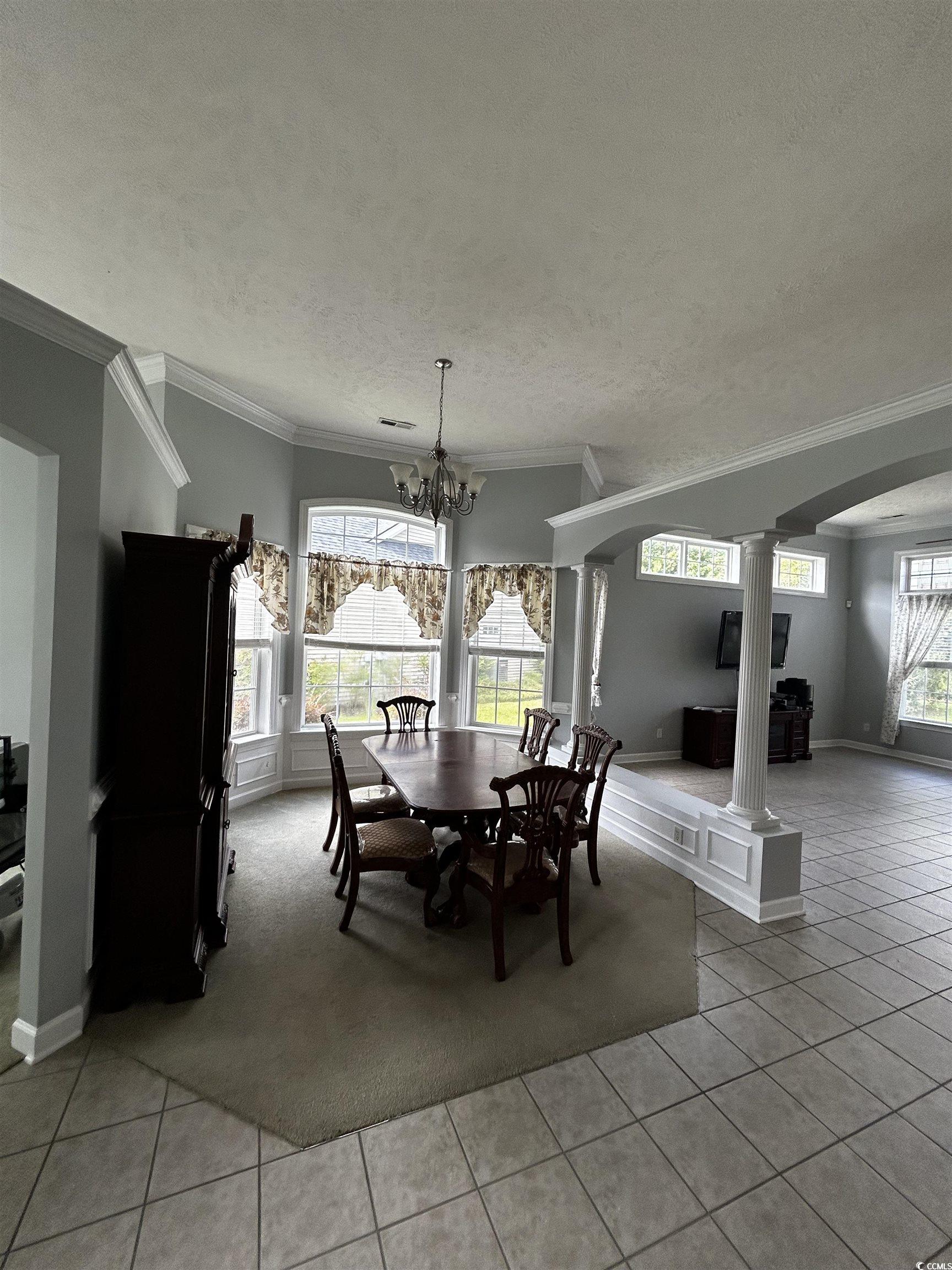 1300 Manchester Court Murrells Inlet, SC 29576 - Photo 13 of 40 Tiled dining room featuring ornamental molding, an