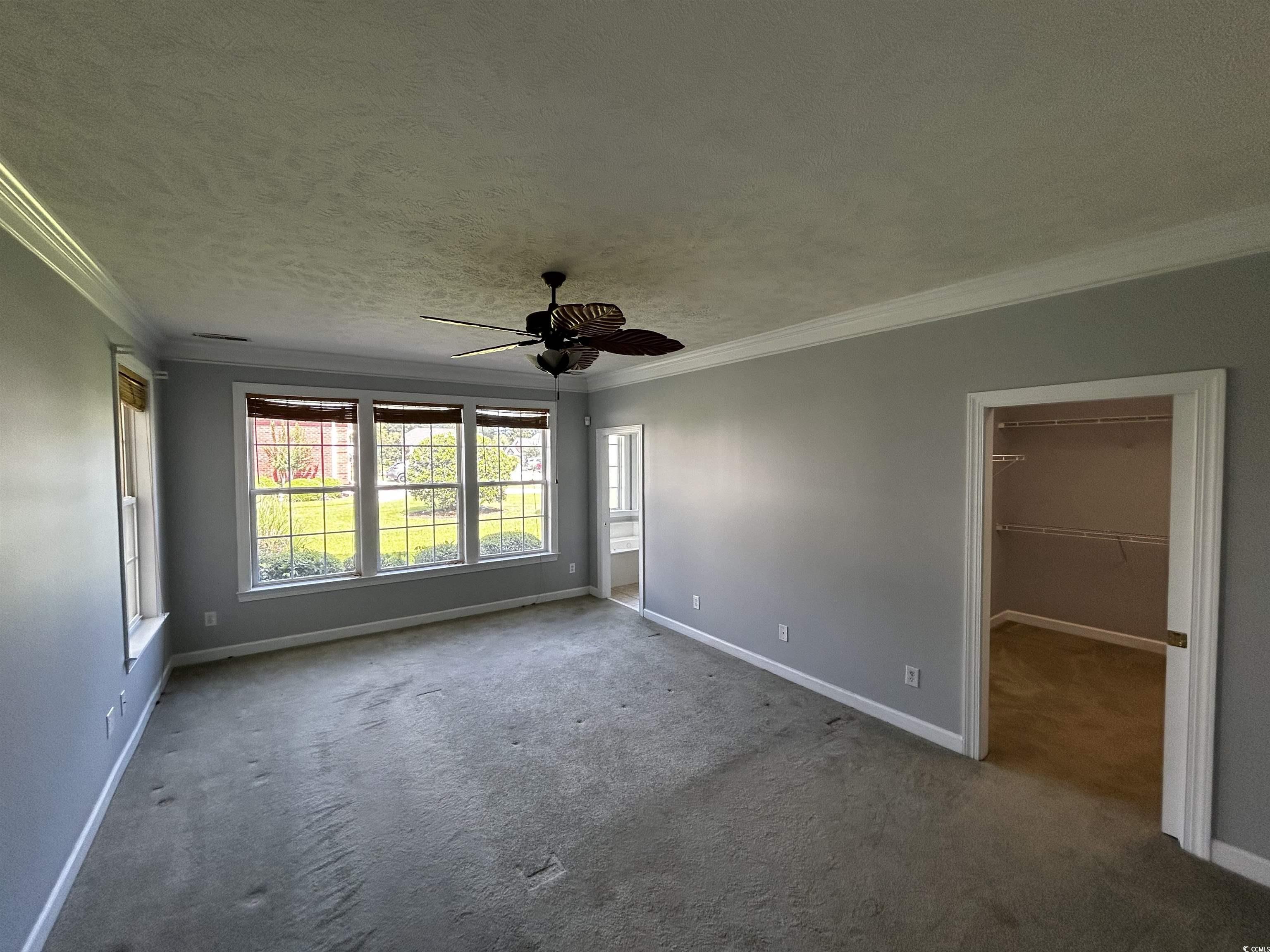 1300 Manchester Court Murrells Inlet, SC 29576 - Photo 17 of 40 Spare room featuring a textured ceiling, carpet, c