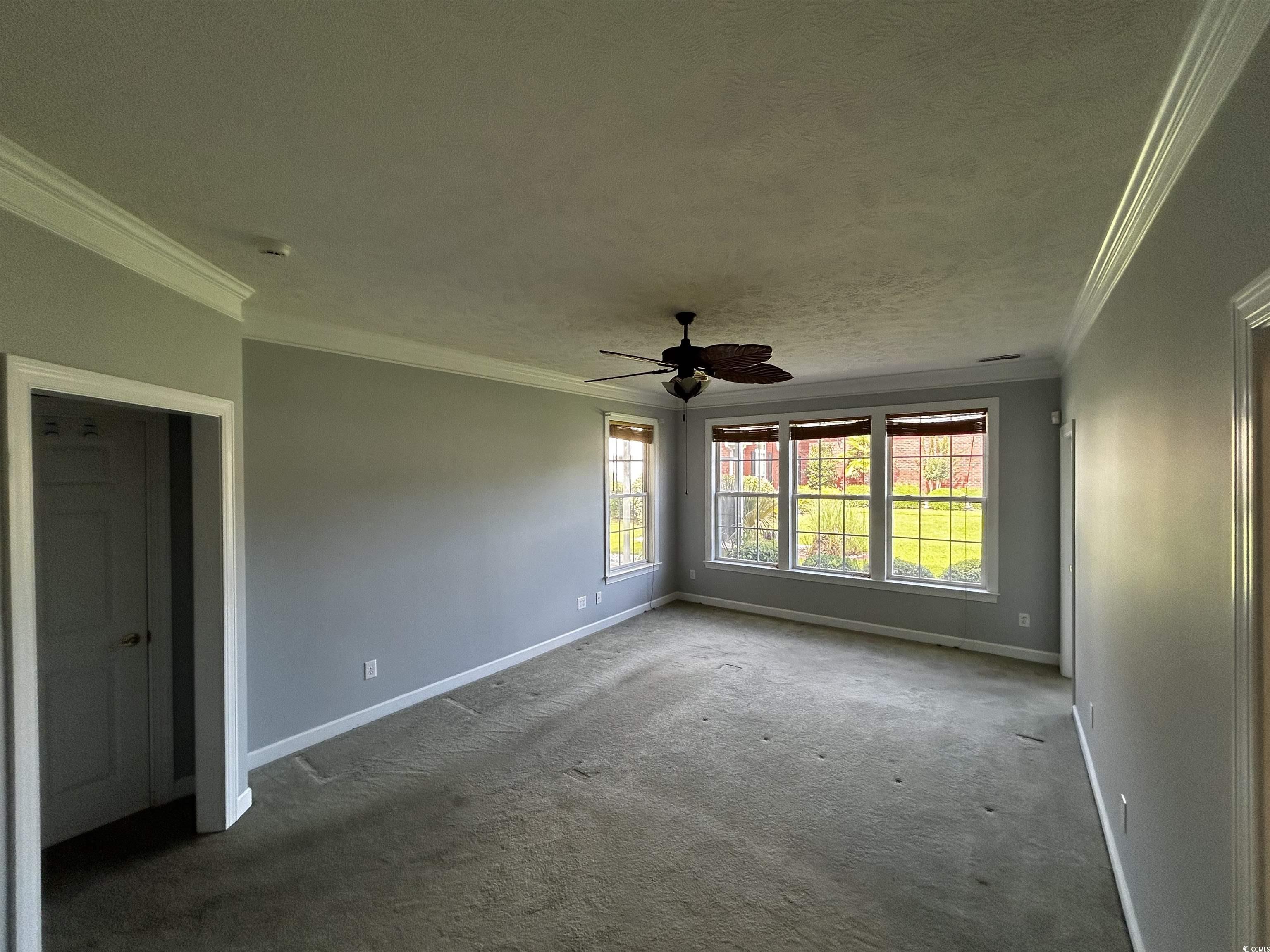 1300 Manchester Court Murrells Inlet, SC 29576 - Photo 18 of 40 Carpeted spare room featuring a textured ceiling,