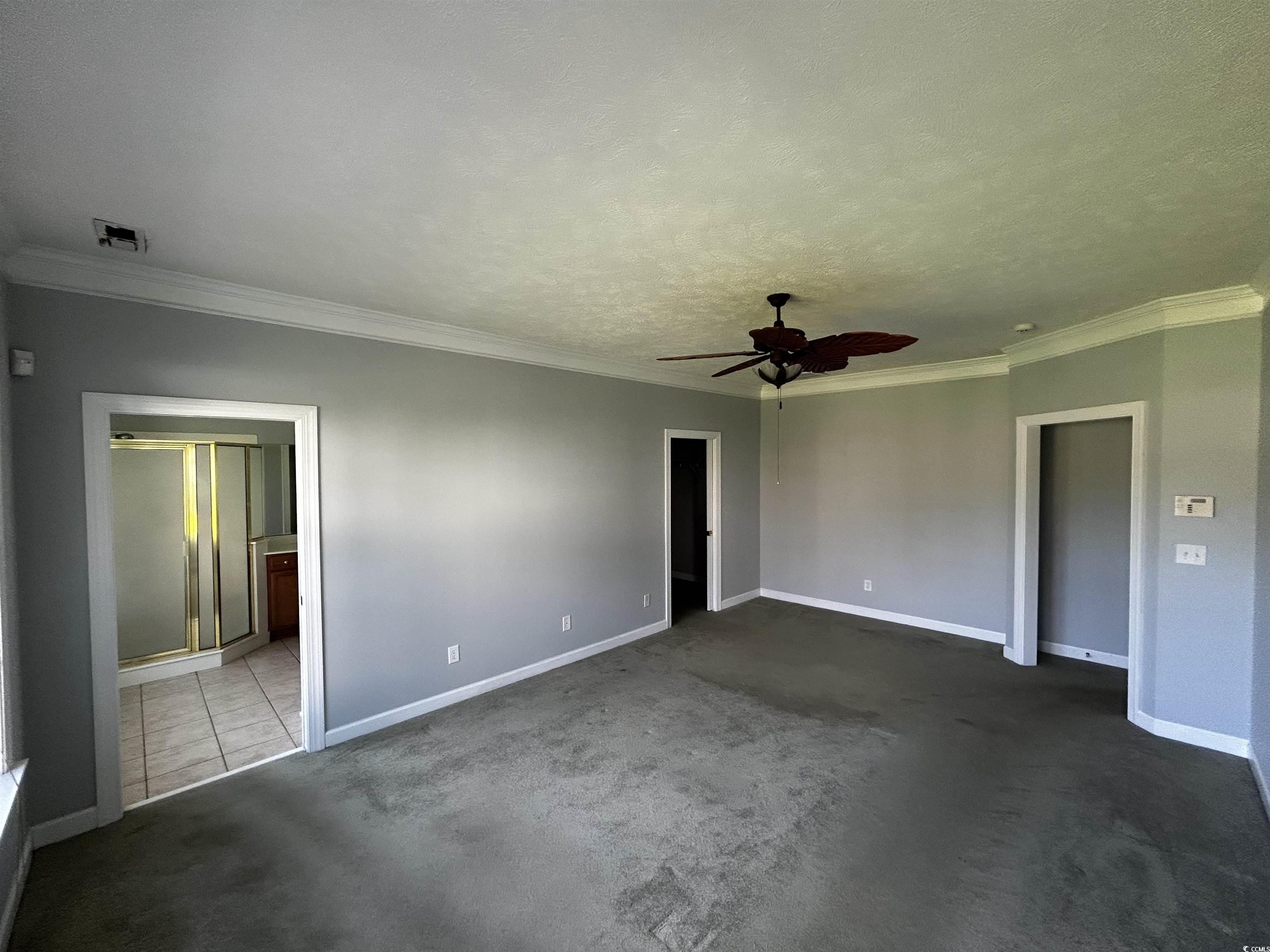 1300 Manchester Court Murrells Inlet, SC 29576 - Photo 20 of 40 Unfurnished bedroom with tile floors, a textured c