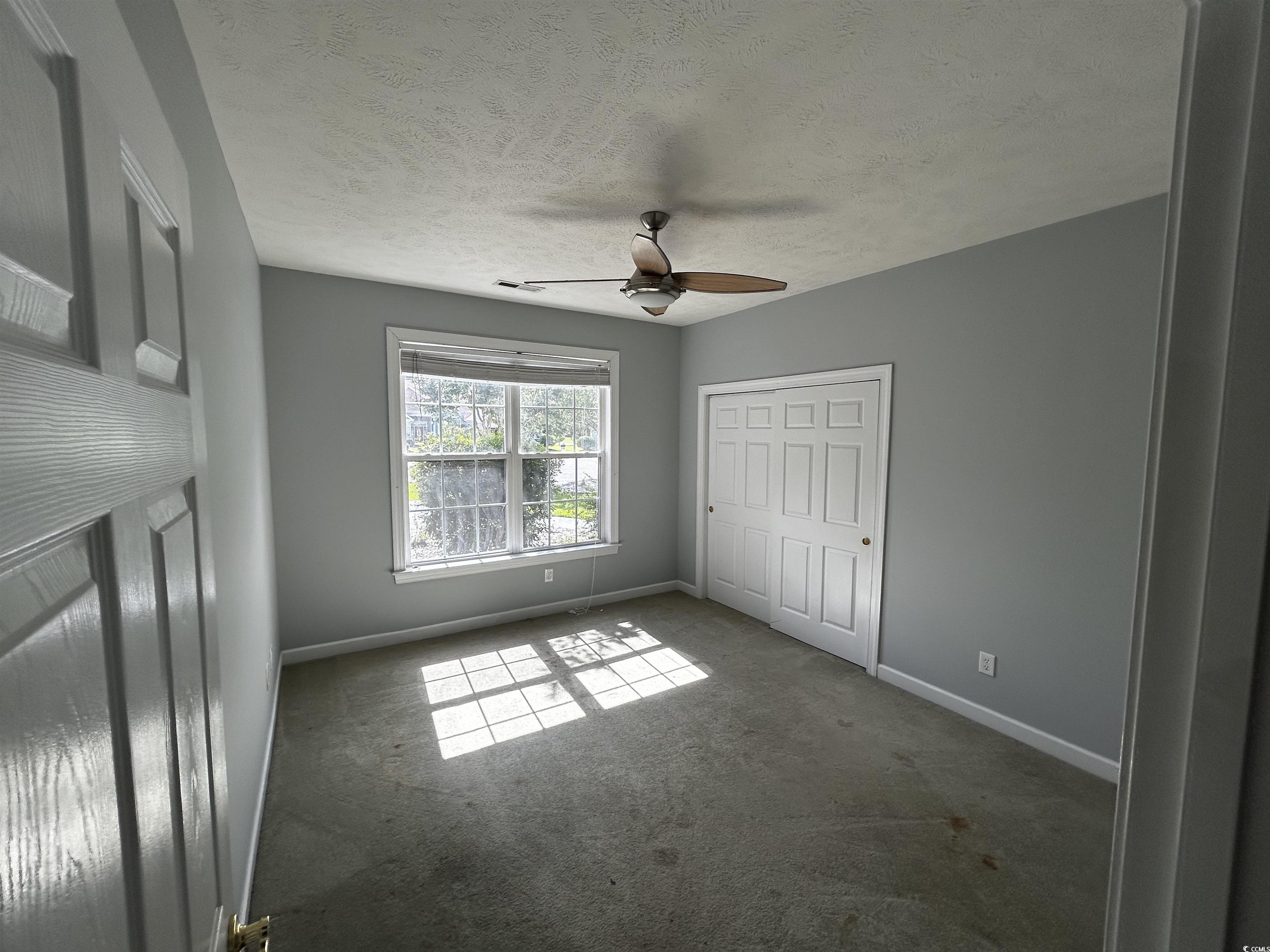 1300 Manchester Court Murrells Inlet, SC 29576 - Photo 30 of 40 Unfurnished bedroom featuring a textured ceiling,