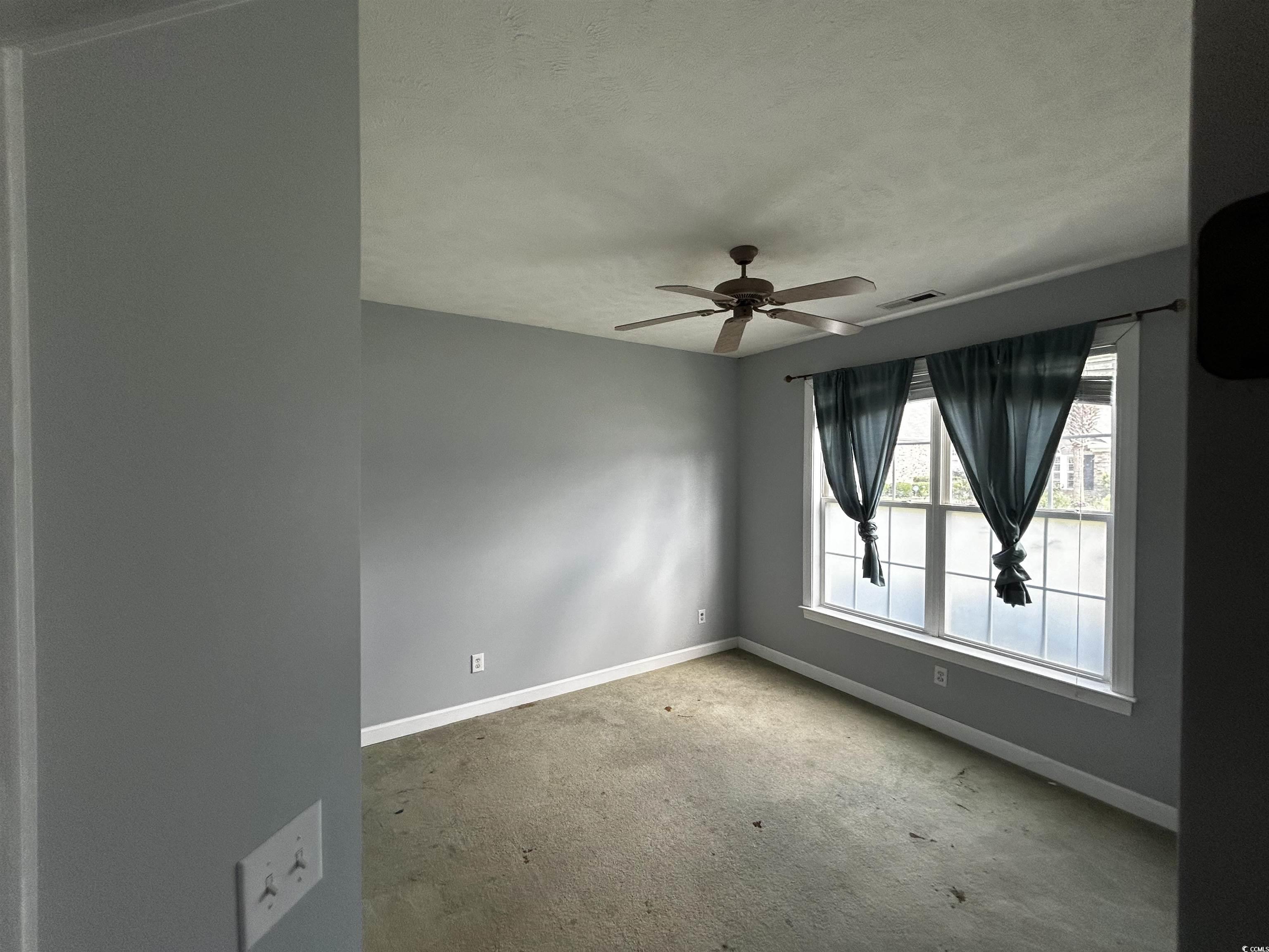 1300 Manchester Court Murrells Inlet, SC 29576 - Photo 34 of 40 Empty room featuring ceiling fan