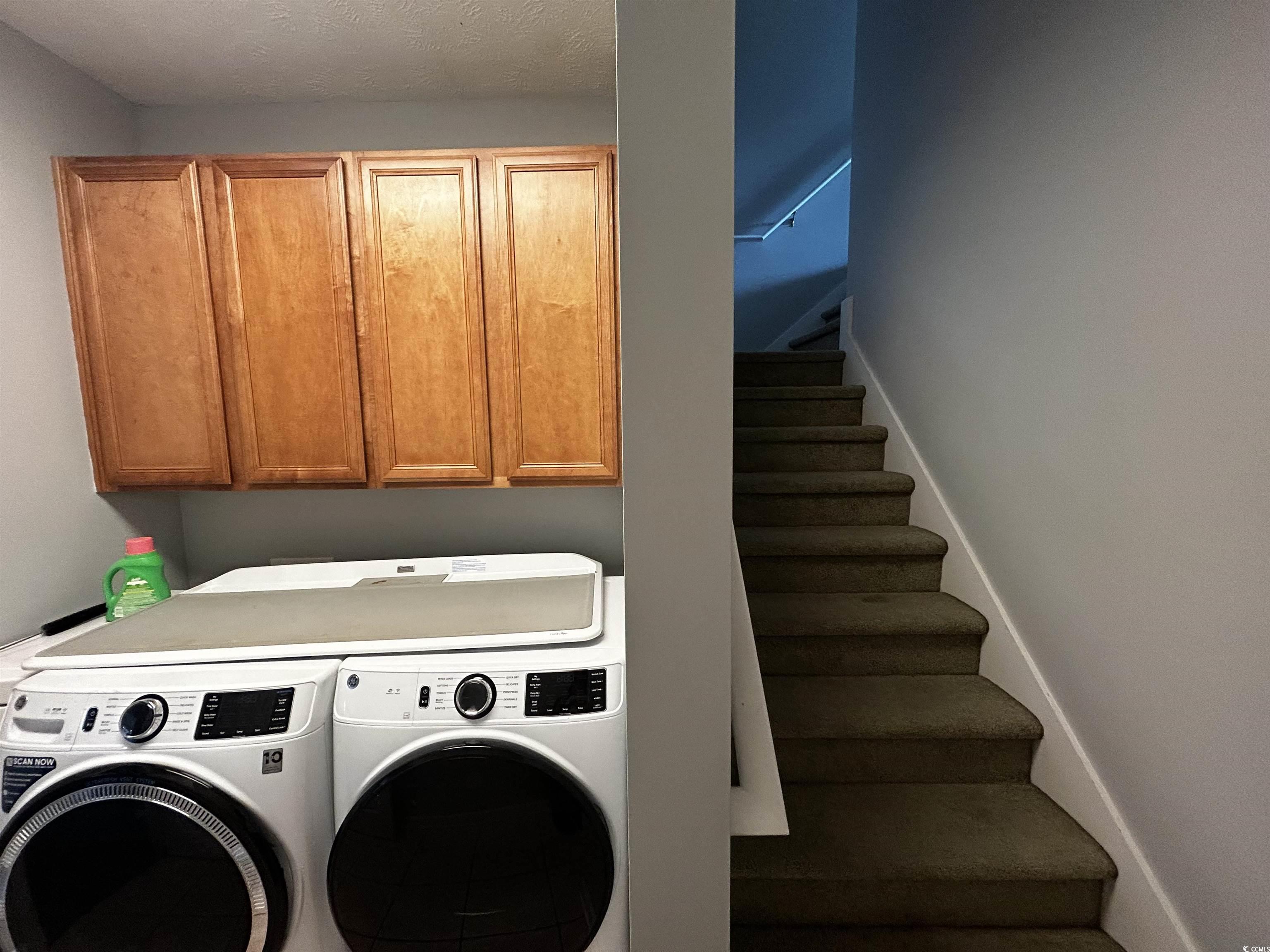 1300 Manchester Court Murrells Inlet, SC 29576 - Photo 37 of 40 Laundry area with cabinets and washing machine and