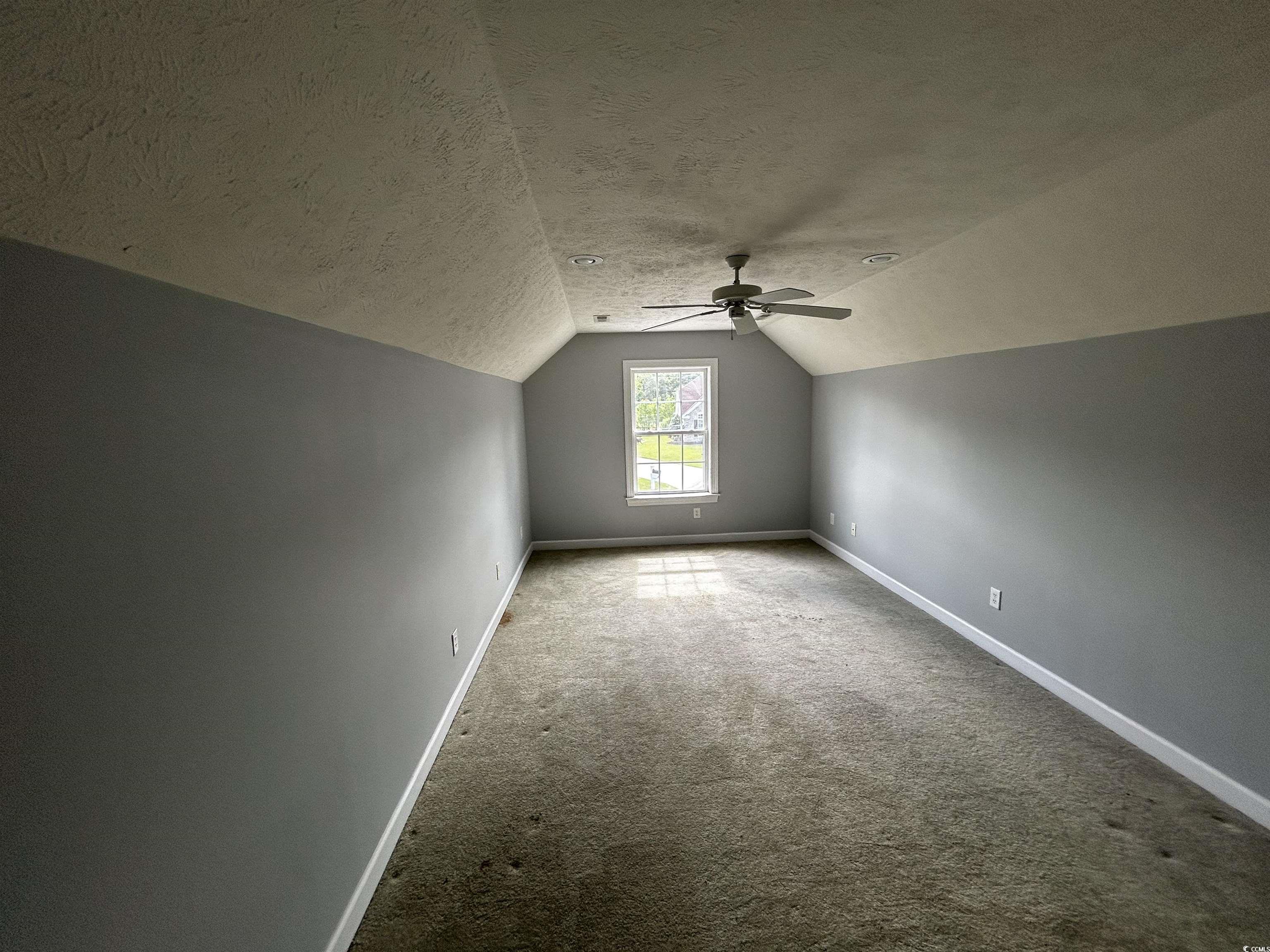 1300 Manchester Court Murrells Inlet, SC 29576 - Photo 38 of 40 Bonus room featuring a textured ceiling, lofted ce