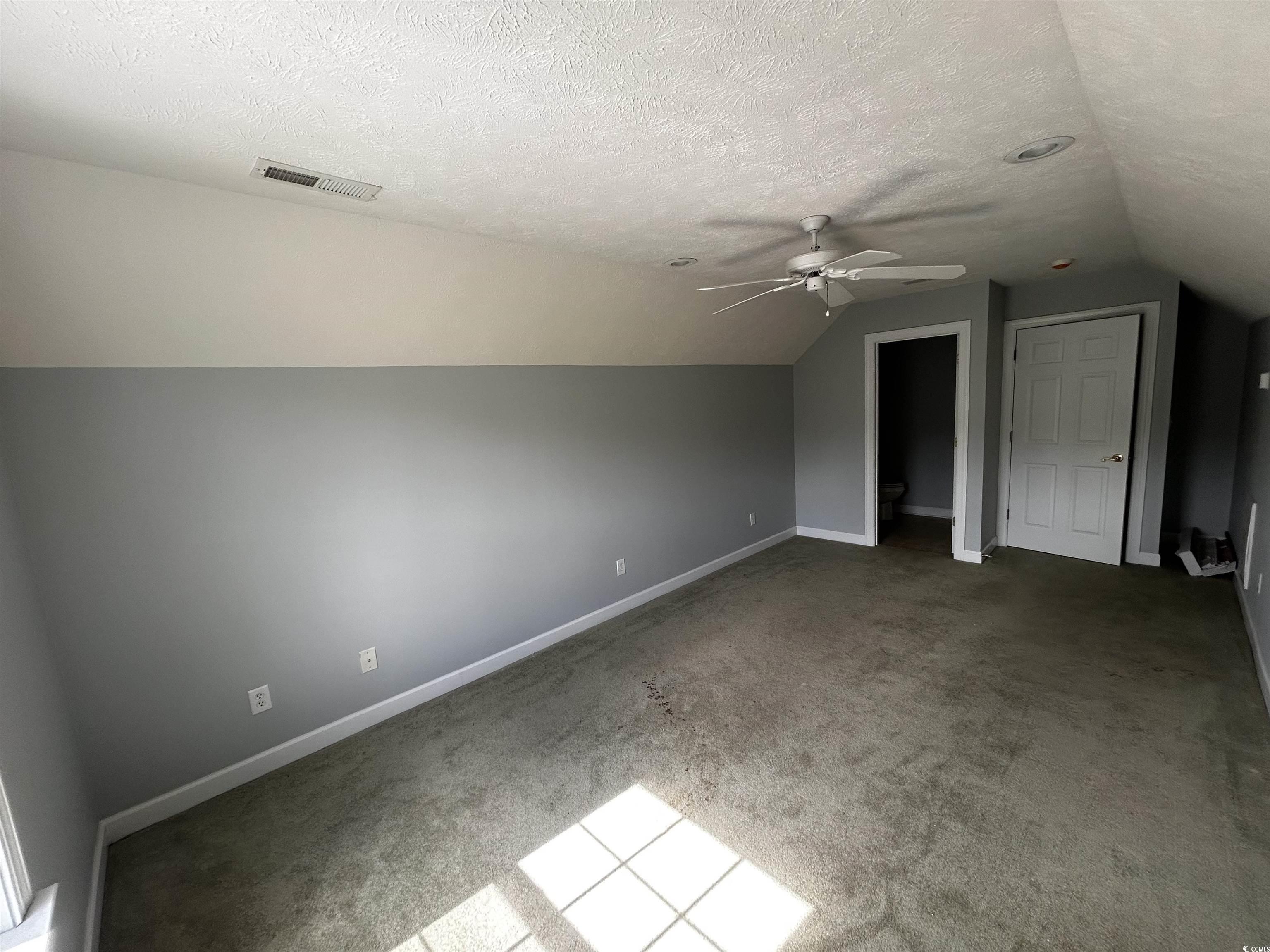 1300 Manchester Court Murrells Inlet, SC 29576 - Photo 39 of 40 Bonus room featuring a textured ceiling, carpet, c