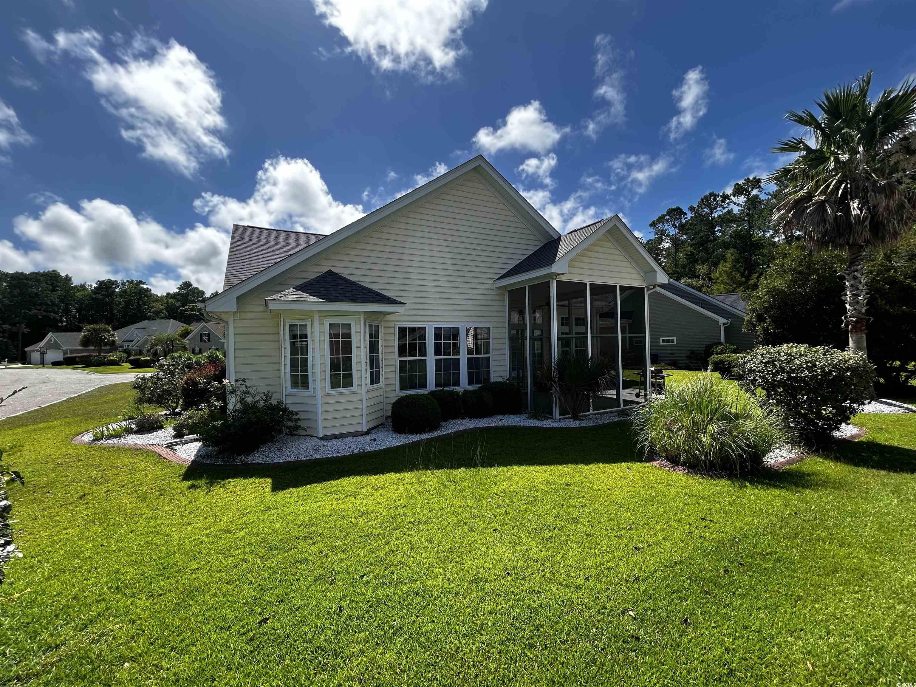 1300 Manchester Court Murrells Inlet, SC 29576 - Photo 4 of 40 Rear view of house featuring a yard and a sunroom