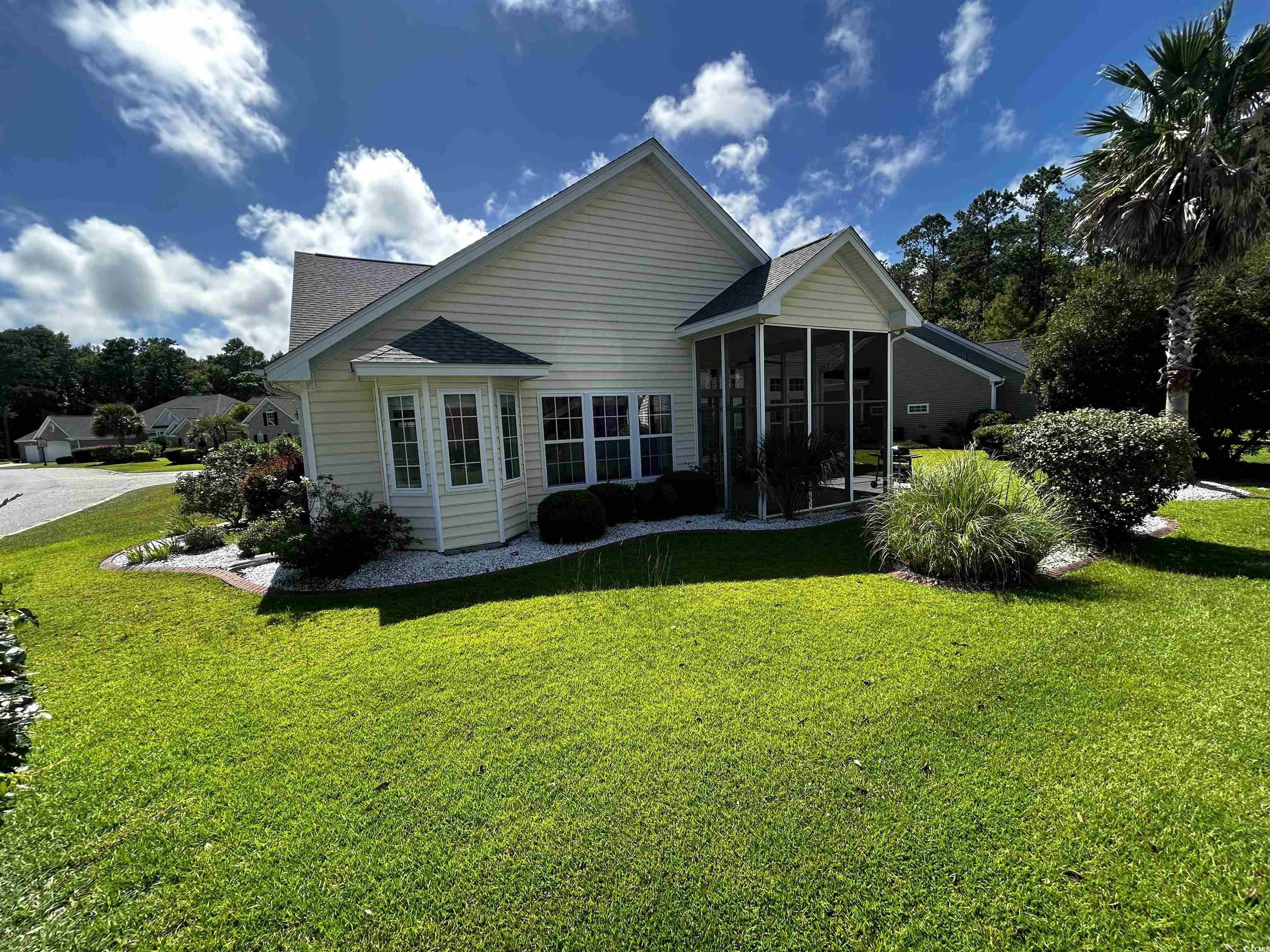1300 Manchester Court Murrells Inlet, SC 29576 - Photo 5 of 40 Back of house with a sunroom and a yard