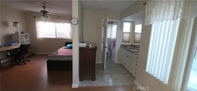 a room with wooden floor and furniture