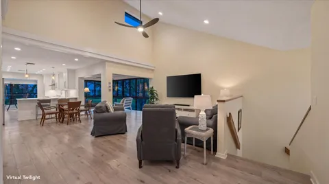 a view of a livingroom with furniture and a flat screen tv