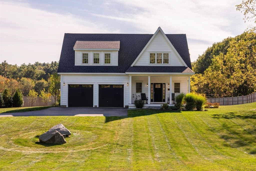 5 John West Road Exeter, NH 03833 - Photo 1 of 33 a front view of house with outdoor seating