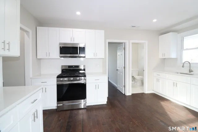 a kitchen with a stove and a sink