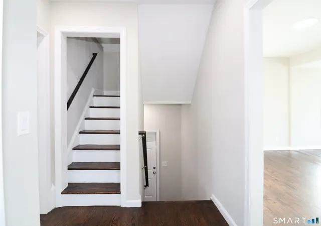 a view of entryway with wooden floor