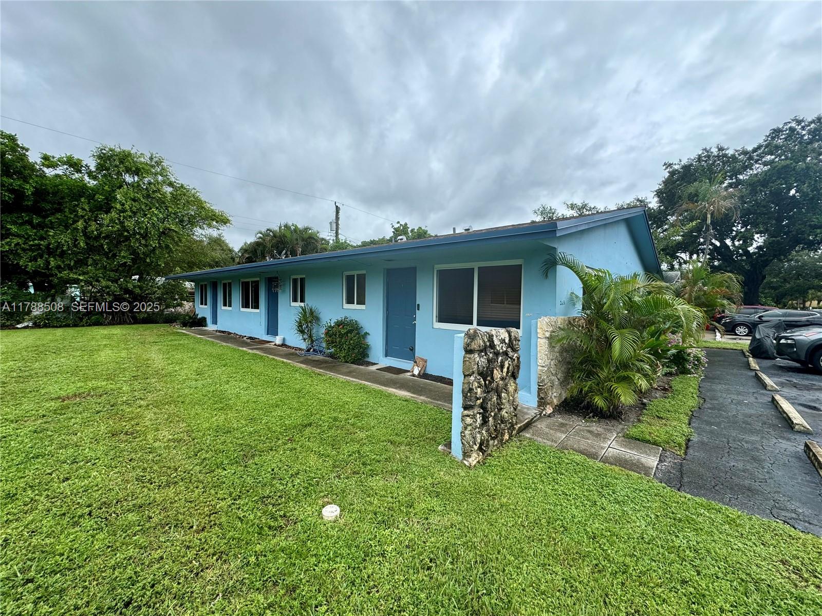 2631 Southwest 13th Avenue Fort Lauderdale, FL 33315 - Photo 18 of 24 a front view of house with a garden and porch